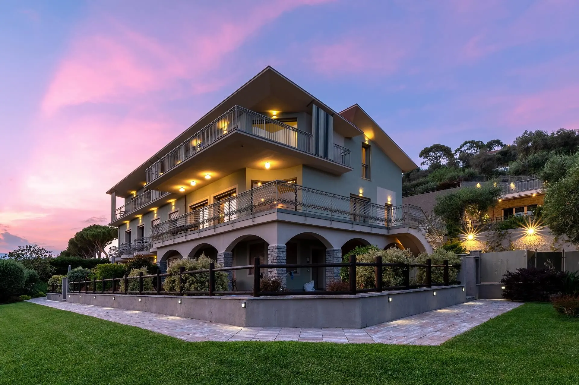 Villa LeA at sunset with the lawn in the foreground